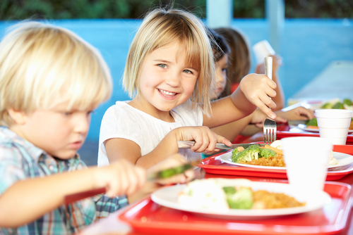 School children eating school dinners